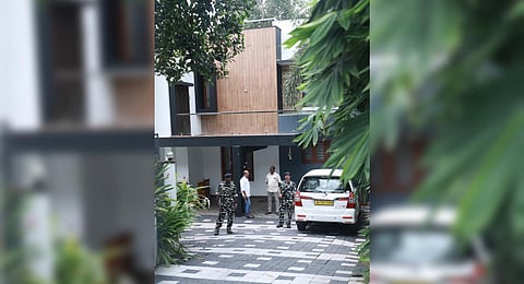 (File photo) Central forces standing guard during an ED raid at the house of Bhasurangan, ex-president of Kandala Service Co operative Bank in Thiruvananthapuram