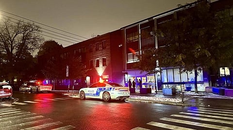 Police cars sit in front of Talmud Torah Elementary School, one of two Jewish schools in Montreal hit by gunfire overnight. (Photo | AFP)