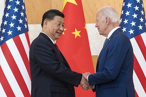 FILE - US President Joe Biden (R) and Chinese President Xi Jinping shake hands before a meeting on the sidelines of the G20 summit meeting on Nov. 14, 2022, in Bali, Indonesia. (Photo | AP)