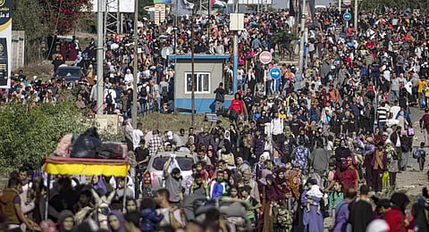 Palestinians flee to the southern Gaza Strip on Salah al-Din Street in Bureij, Gaza Strip, Friday, Nov. 10, 2023. (Photo | AP)