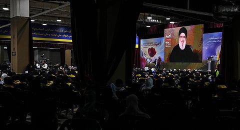 Supporters of the Iranian-backed Hezbollah group listen to a speech by Hezbollah leader Sayyed Hassan Nasrallah via a video link.(Photo | AP)