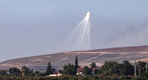 This picture taken from the moshav Kfar Yuval in northern Israel shows a shell fired by Israeli troops, exploding over hills in southern Lebanon. (Photo | AFP)