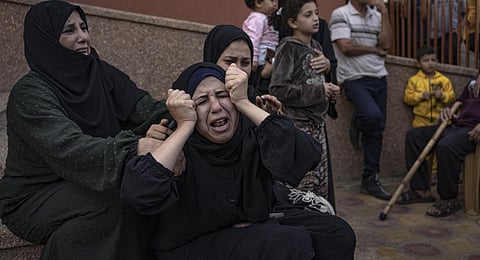 Palestinians mourn their relatives killed in the Israeli bombardment of the Gaza Strip, in the hospital in Khan Younis, Saturday, Nov. 11, 2023.(Photo | AP)