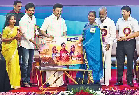Chief Minister MK Stalin distributing ATM cards to beneficiaries of the ‘Kalaignar Magalir Urimai Thittam’ at Kalaivanar Arangam in Chennai | Ashwin Prasath