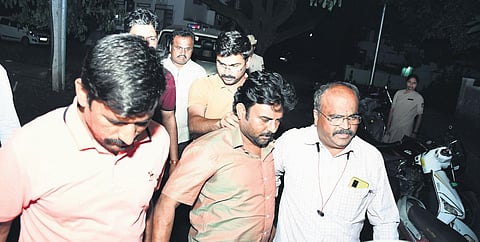 RD Patil being brought to Ashoknagar police station in Kalaburagi on Friday evening. (Photo | Express)