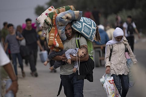 Palestinians flee to the southern Gaza Strip on Salah al-Din Street in Bureij, Gaza Strip, Saturday, Nov. 11, 2023. (Photo | AP)