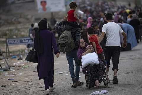 Palestinians flee to the southern Gaza Strip on Salah al-Din Street in Bureij, Gaza Strip, Saturday, Nov. 11, 2023. (Photo | AP)