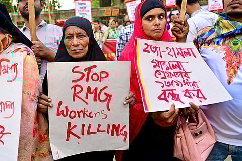 Hundreds of Bangladeshi garment workers rallied Sunday in Dhaka (AFP)