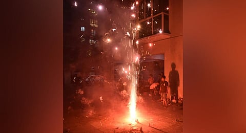 Children burst firecrackers to celebrate Diwali at a private apartment in Chennai, on Nov 11, 2023. (Photo | P Jawahar, EPS)
