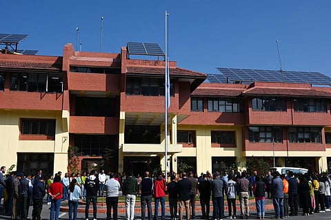 The flag of the United Nations flies at half-mast to mourn the lives of workers lost during the war between Israel and Hamas, in front of its building in Kathmandu on November 13, 2023. (Photo | AFP)