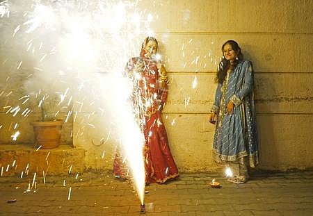 The Sound of laughter echoes through the air as families come together, bursting crackers to celebrate the festival of lights at Kanakapura in Bengaluru. (Photo | Allen Egenuse J)