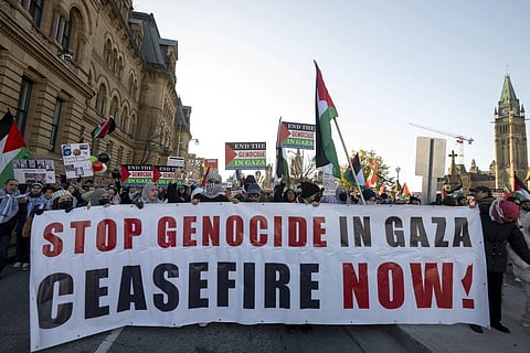 Pro-Palestinian supporters take part in a demonstration in downtown Ottawa, Ontario, Sunday, Nov 12, 2023. (Photo | AP)