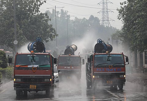 Mobile anti-smog guns spray water to curb air pollution after their flag-off by Delhi Environment Minister Gopal Rai, at Delhi Secretariat, in New Delhi, Tuesday, Nov. 14, 2023. (PTI)