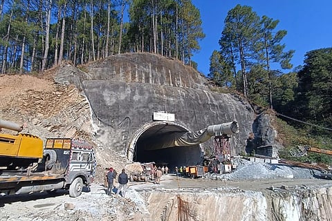 Rescue workers gather near the site after a tunnel collapsed in the Uttarkashi district of India's Uttarakhand state on November 13, 2023. (Photo | AFP)
