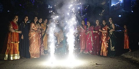 People burn firecrackers during Diwali in New Delhi.