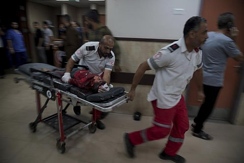 A Palestinian wounded in the Israeli bombardment of the Gaza Strip is brought to a hospital in Deir al-Balah on Tuesday, Nov. 14, 2023. (Photo | AP)