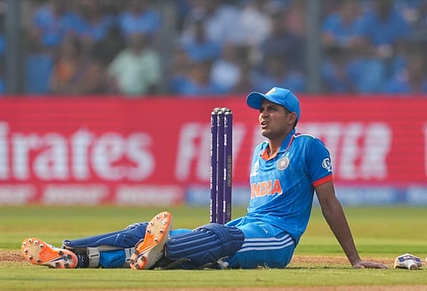 Shubman Gill sits on the ground after an injury during the ICC Men's Cricket World Cup semifinal match between India and New Zealand, at Wankhede Stadium in Mumbai. (PTI)