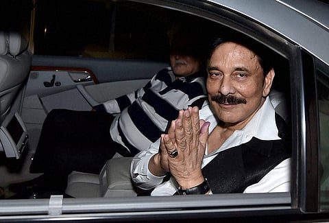 FILE | 07/05/2016: Sahara chief Subrata Roy at Lucknow airport after being allowed to leave prison for four weeks for the funeral of his mother Chhabi Roy. (PTI)
