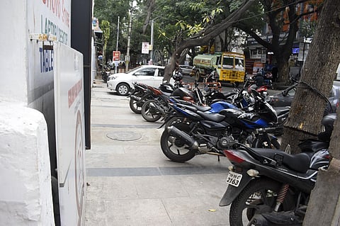 Two Wheelers parked on the pedestrian pathway at TV swamy road at RS puram in Coimbatore on Tuesday. (Photo | S Senbagapandiyan)