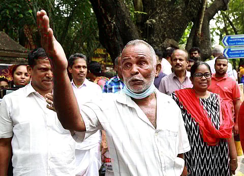 A large number of people gathered outside the Ernakulam additional district sessions court complex. (Photo | T P Sooraj)