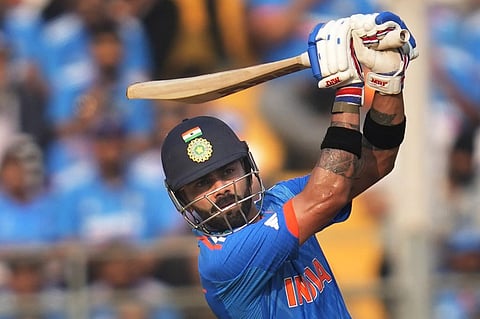 Virat Kohli plays a shot during the World Cup semifinal match between India and New Zealand in Mumbai (Photo | AP)
