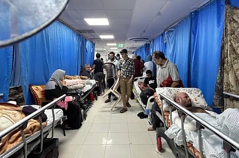Patients and internally displaced people shelter at Al-Shifa hospital in Gaza City on November 10. (Photo | AFP)