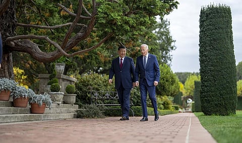 US President Joe Biden and China's President President Xi Jinping walk in the gardens at the Filoli Estate in Woodside, Calif., Wednesday, Nov 15, 2023. (Photo | AP)