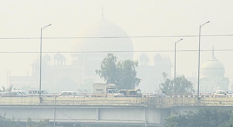 Commuters out on a smoggy morning amid rising air pollution levels. (Photo | Parveen Negi)