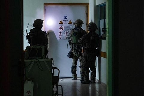 This handout picture released by the Israeli army on November 15, 2023, reportedly shows Israeli soldiers carrying out operations inside Al-Shifa hospital in Gaza City. (Photo | AP)
