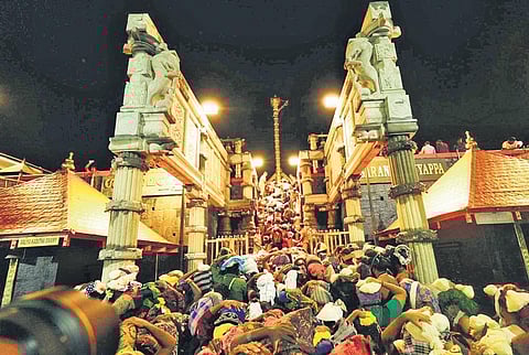 Devotees ascending 18 holy steps at the hill shrine in Sabarimala | Shaji Vettipuram