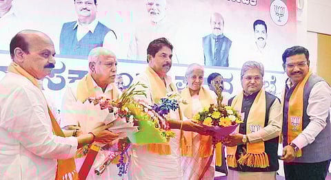 BJP leaders Basavaraj Bommai, BS Yediyurappa, Nirmala Sitharaman, Dushyant Gautam Kumar, BY Vijayendra congratulate newly appointed LoP R Ashoka, in Bengaluru on Friday. (Photo | Shashidhar Byrappa)