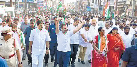 Congress leader Rahul Gandhi waves to the crowd during his padayatra in Warangal East Assembly constituency