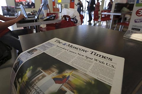 FILE - A copy of The Moscow Times newspaper is seen at a cafe in Sheremetyevo airport, Moscow, Wednesday, June 26, 2013. (Photo | AP)
