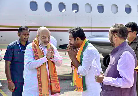 Amit Shah being received by Union Minister and Telangana BJP President G. Kishan Reddy (Photo | PTI)