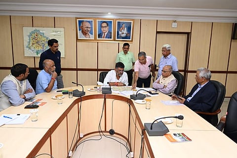 Bengaluru Development Minister DK Shivakumar interacts with officials at the BDA office in Bengaluru on Friday. (Photo | Express)