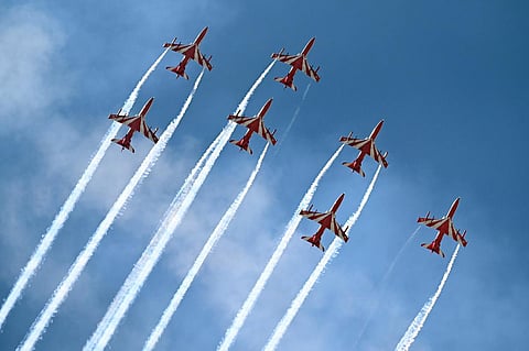 In the image, the Indian Air Force's aerobatic team Suryakiran, which was formed in 1996, is flying in a formation during the event. (Photo | Nagaraja Gadekal, EPS)