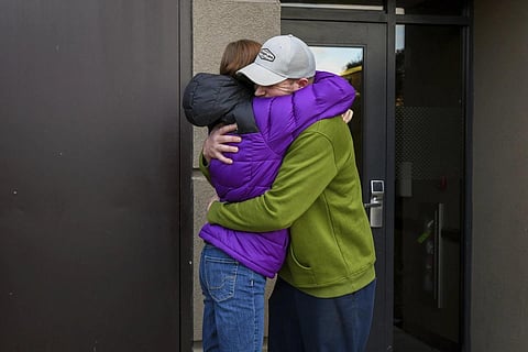 Alexandria Johnson, 35, embraces her fiance, Greg Fenell, 42, as he departs for work, Thursday, Nov 2, 2023. (Photo | AP)