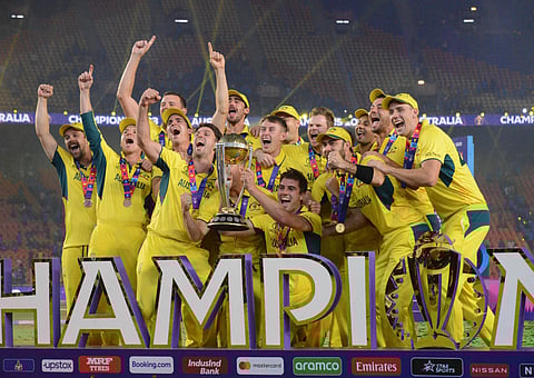 Australian players celebrate with the trophy after winning the ICC Mens Cricket World Cup 2023 finals at the Narendra Modi Stadium, in Ahmedabad, Sunday, Nov. 19, 2023. (Photo | Shiba Prasad Sahu)