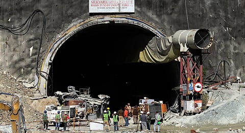 Security personnel and others at the under-construction tunnel between Silkyara and Dandalgaon, days after a portion of the tunnel collapsed trapping several workers inside, in Uttarkashi district. (P