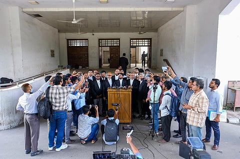 Bangladesh's largest Islamist party Jamaat-e-Islami's lawyer Matiur Rahman Akanda, addresses journalists. (Photo | AP)