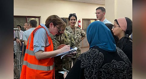 Dual national Palestinians and foreigners undergo identification process as they arrive from the Gaza Strip in the Egyptian side of the Rafah border. (Photo | AFP)