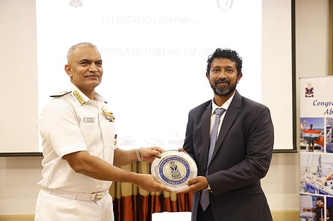 Admiral R Hari Kumar, chief of the naval staff, presenting the memento to Cdr Abhilash Tomy (retd)