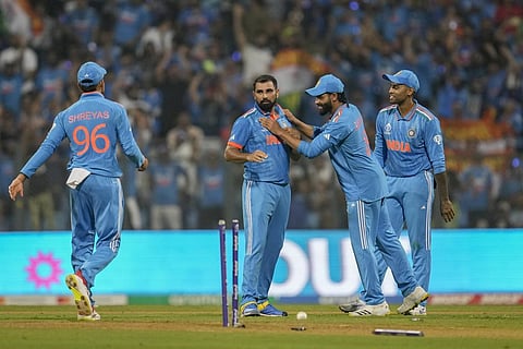 Mohammed Shami celebrates with teammates after the dismissal of Sri Lanka's Angelo Mathews during the World Cup match in Mumbai (Photo | AP)