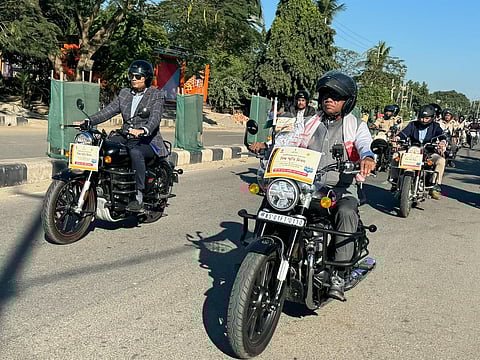 Assam’s transport minister Parimal Suklabaidya riding a Royal Enfield motorcycle to create awareness among people on road safety. (Photo | Express)