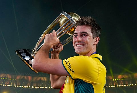 Australian captain Pat Cummins holds the trophy after winning the ICC Mens Cricket World Cup 2023, at the Narendra Modi Stadium, in Ahmedabad, Sunday, Nov. 19, 2023. (Photo | PTI)