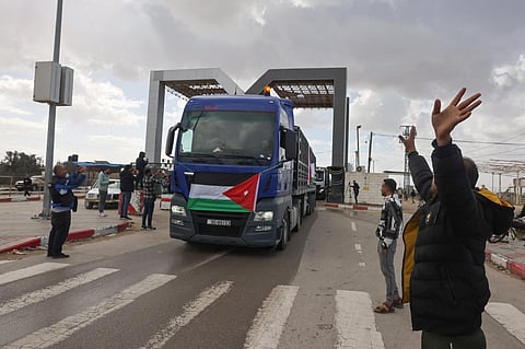 An aid convoy bearing the Jordanian flag enters the Gaza Strip through the Rafah crossing with Egypt, on November 20 | AFP