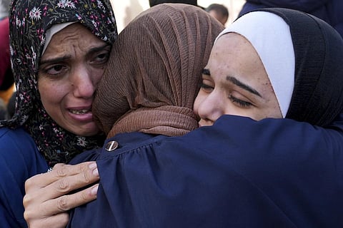 Palestinians mourn relatives killed in the Israeli bombardment of the Gaza Strip, Sunday, Nov 19, 2023. (Photo | AP)