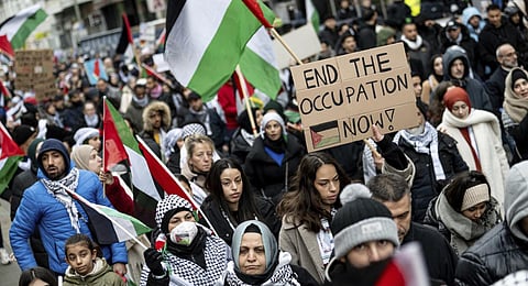 People take part in a demonstration for Palestinians, and against Israel's attack on the Gaza Strip, in Berlin, Germany, Saturday, Nov. 18, 2023.