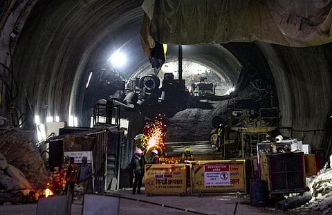 NDRF personnel and others at the under-construction tunnel between Silkyara and Dandalgaon on the Brahmakhal-Yamunotri national highway, in Uttarkashi. (Photo | PTI)