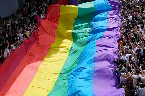 Participants hold a rainbow flag during a Pride Parade in Bangkok, Thailand, on June 4, 2023. (File photo | AP)